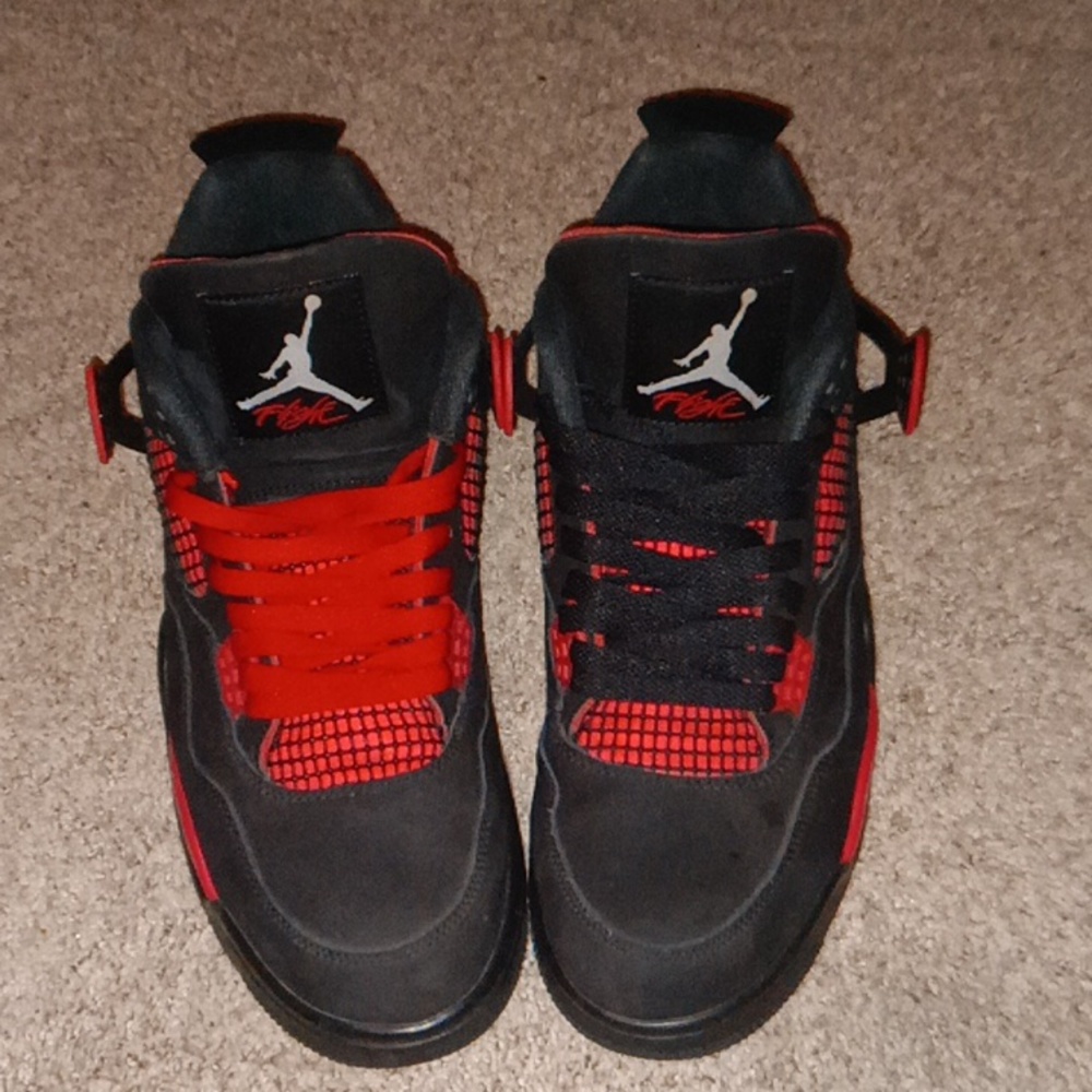 Jordan 4 red thunder size 10 and 1/2 black and red